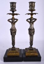 A PAIR OF 19TH CENTURY FRENCH BRONZE FIGURAL CANDLESTICKS formed with maiden columns. 25 cm high.