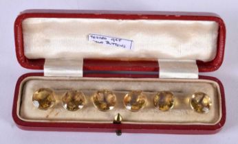 A Cased set of Six 9ct Gold Mounted Citrine Buttons. 1cm diameter