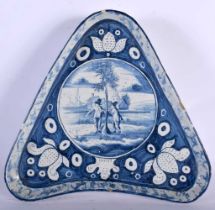 AN UNUSUAL 18TH CENTURY DUTCH DELFT BLUE AND WHITE TIN GLAZED TRIANGULAR DISH painted with figures