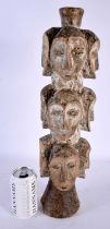 AN UNUSUAL EARLY 20TH CENTURY AFRICAN PAINTED WOOD TRIBAL TOTEM POLE formed with numerous faces.