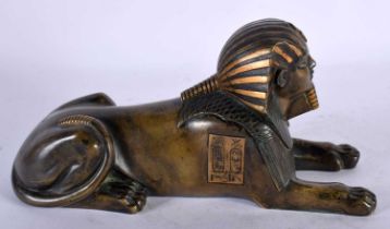 A 19TH CENTURY FRENCH EGYPTIAN REVIVAL BRONZE FIGURE OF A SEATED SPHINX After the Antiquity. 26 cm x