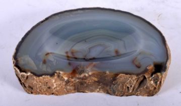 A NATURAL HISTORY AGATE CARVED OVAL DISH of naturalistic form. 15 cm x 11 cm.