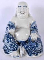 AN EARLY 20TH CENTURY CHINESE BLUE AND WHITE PORCELAIN FIGURE OF A BUDDHA Late Qing/Republic. 22cm x