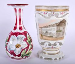 A SMALL 19TH BOHEMIAN ENAMELLED PINK GLASS VASE together with a similar cup painted with a street