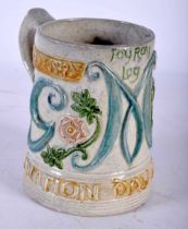 AN UNUSUAL COMPTON SURREY POTTERY CORONATION DAY JUNE 22ND 1911 MUG. 12 cm x 14 cm.