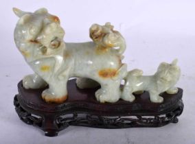 AN EARLY 20TH CENTURY CHINESE CARVED JADE FIGURE OF BUDDHIST LIONS Late Qing/Republic. 16 cm x 12