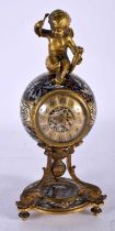 A GOOD 19TH CENTURY FRENCH CHAMPLEVE ENAMEL AND BRONZE CLOCK modelled with a seated putti upon a