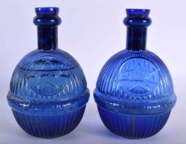 TWO STAR BLUE GLASS GRENADE FIRE EXTINGUISHERS. 18 cm x 8 cm. (2) Note: We are unable to ship this