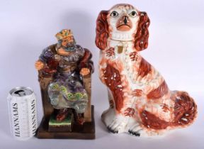 A LARGE ANTIQUE STAFFORDSHIRE SPANIEL together with a Royal Doulton figure 'the old king'. Largest