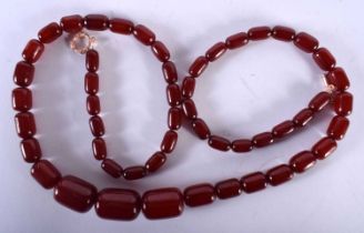 A Cherry Amber Type Bead Necklace. Length 87cm, Largest Bead 18.8mm, weight 87g