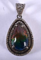 A Diamond and Black Opal,Pendant. 3.4cm x 1.8cm, weight 4.9g