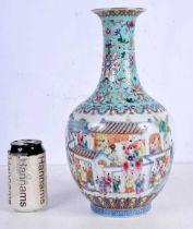 A Chinese porcelain Famille Rose vase decorative with a procession of lamp bearers 34 cm