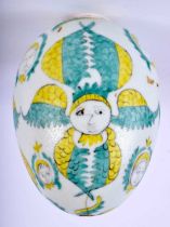 AN ARMENIAN KUTAHYA POTTERY HANGING EGG painted with figures. 12 cm x 8 cm.