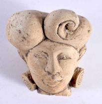 AN EARLY MIDDLE EASTERN INDIAN STUCCO PORTRAIT BUST HEAD modelled with stylised earrings. 9 cm x