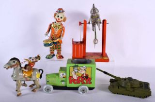 FOUR VINTAGE TIN PLATE TOYS and a dinky truck. Largest 23 cm high. (5)