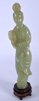 A 19TH CENTURY CHINESE CARVED JADE FIGURE OF AN IMMORTAL Late Qing, modelled holding a fan. 18 cm