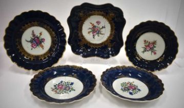 18th century Worcester wet blue wares: a pair plates painted with Chinese style flowers, Two