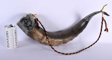 A FINE LARGE EARLY VICTORIAN CARBED POWDER HORN mounted in niello silver work. 43 cm wide.