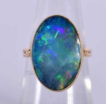 An 18ct Gold Ring set with a Black Opal. Size L, weight 4.57g