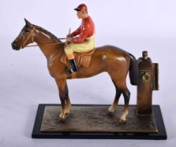 AN EARLY 20TH CENTURY AUSTRIAN COLD PAINTED SPELTER EQUESTRIAN TABLE LIGHTER formed as a jockey.