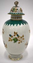18th century Worcester tea canister and cover painted in green and gilt flowers on a ribbed body the
