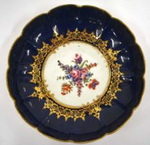18th century Worcester fine deep dish painted with flowers surrounded by elaborate gilding and a wet