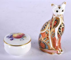 A SMALL ROYAL WORCESTER PILL BOX by Banks, together with a Crown Derby imari cat paperweight.