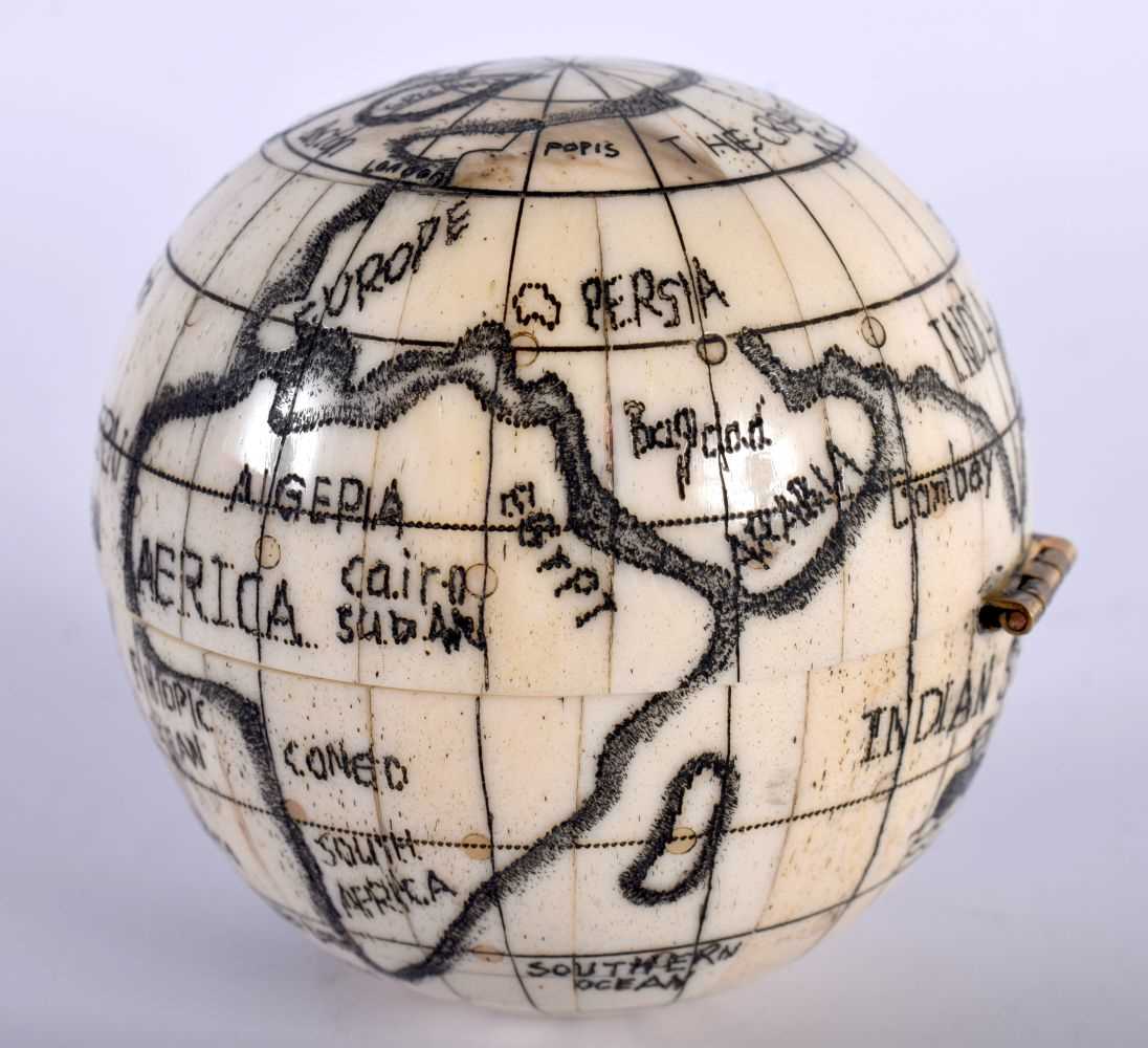 A Bone Globe with a Compass insert. 7cm x 7cm x 7cm - Image 2 of 5