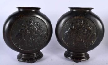 A PAIR OF 19TH CENTURY CHINESE BRONZE PILGRIM MOON FLASKS Qing, decorative with immortals within a