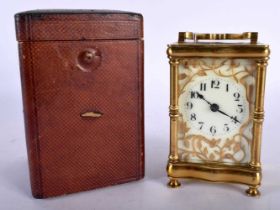A CASED ANTIQUE BRASS CARRIAGE CLOCK. 14.5 cm high inc handle.