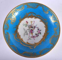 A FINE 18TH CENTURY FRENCH SEVRES PORCELAIN SAUCER painted with love birds under a blue banding.