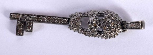 A Diamond Skull and Key Pendant. 4cm x 1cm, weight 2.54g