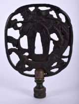 A 19TH CENTURY JAPANESE MEIJI PERIOD IRON TSUBA formed with dragons. 143 grams. 10.5 cm x 7.5 cm.