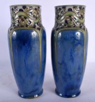 A STYLISH PAIR OF ROYAL DOULTON STONEWARE VASES with arts and crafts style borders. 26 cm high.