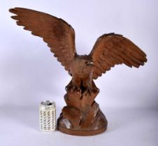A LARGE 19TH CENTURY BAVARIAN BLACK FOREST CARVED WOOD MODEL OF A HAWK modelled with arms
