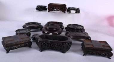 A LARGE COLLECTION OF SMALL 19TH/20TH CENTURY CHINESE HARDWOOD STANDS Qing. (qty)