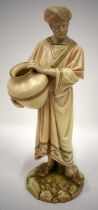 Royal Worcester figure of a middle eastern man with a water pot, painted in two tone ivory and other