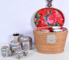 A set of Chinese Porcelain Famille rose graduating lidded pots together with a cased Famille rose