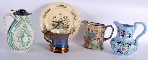 AN 18TH CENTURY ENGLISH CREAMWARE BIRD PLATE together with three antique jugs and a lustre mug.