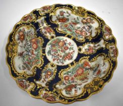 18th century Worcester silver shaped plate with blue scale ground,having gilt panels with Kakiemon