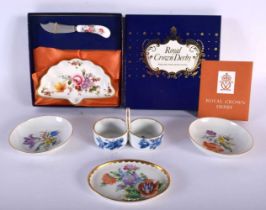 A GERMAN MEISSEN PORCELAIN SALT together with three Meissen dishes and a boxed Royal Crown Derby