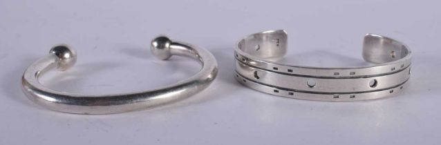 A Silver Cuff Bangle Stamped 925 together with another. Largest 6.4cm internal, weight of silver