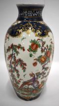 18th century Worcester vase painted in kakiemon style on a blue scale ground 26cm high