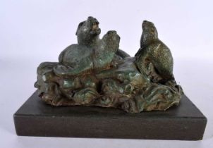 A CHARMING ART DECO GREEN VERDIGRIS BRONZE FIGURE OF SEA LIONS modelled upon crashing waves and a