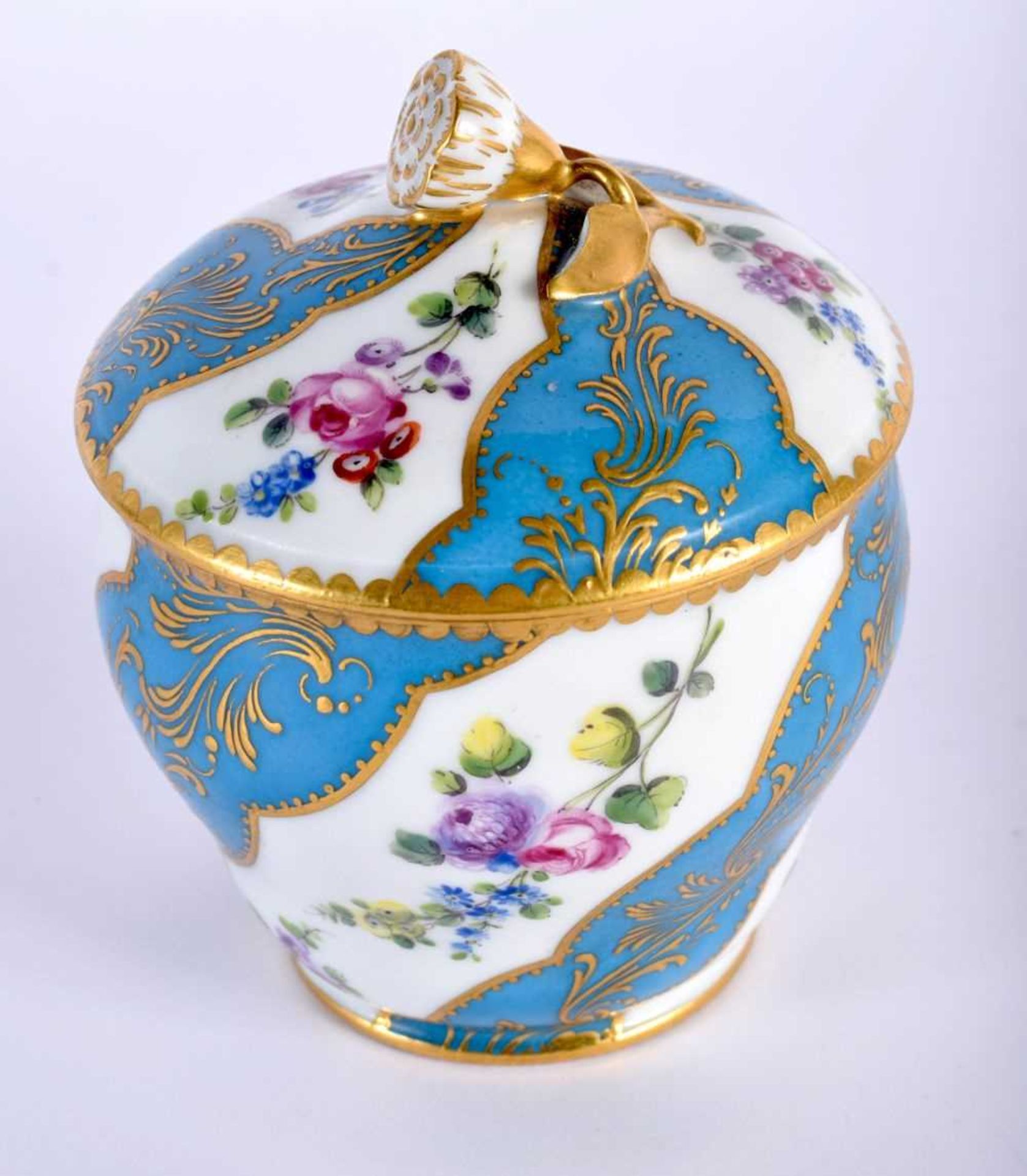 Sevres sucrier and cover painted with scrolling panels of alternating white and turquoise, the