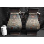 A LARGE PAIR OF 19TH CENTURY CHINESE TWIN HANDLED CHAMPLEVE ENAMEL BRONZE VASES decorated with