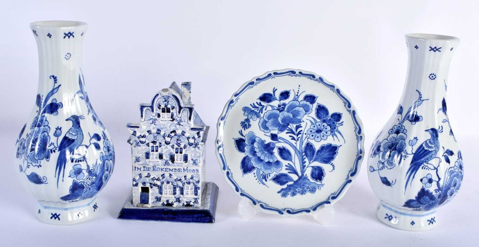 ASSORTED DUTCH DELFT BLUE AND WHITE POTTERY. Largest 19 cm high. (4)