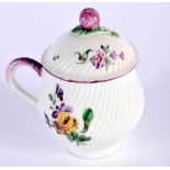 Mennecy custard cup and saucer painted with flowers on a spirally moulded ground, incised DV. 9x6.