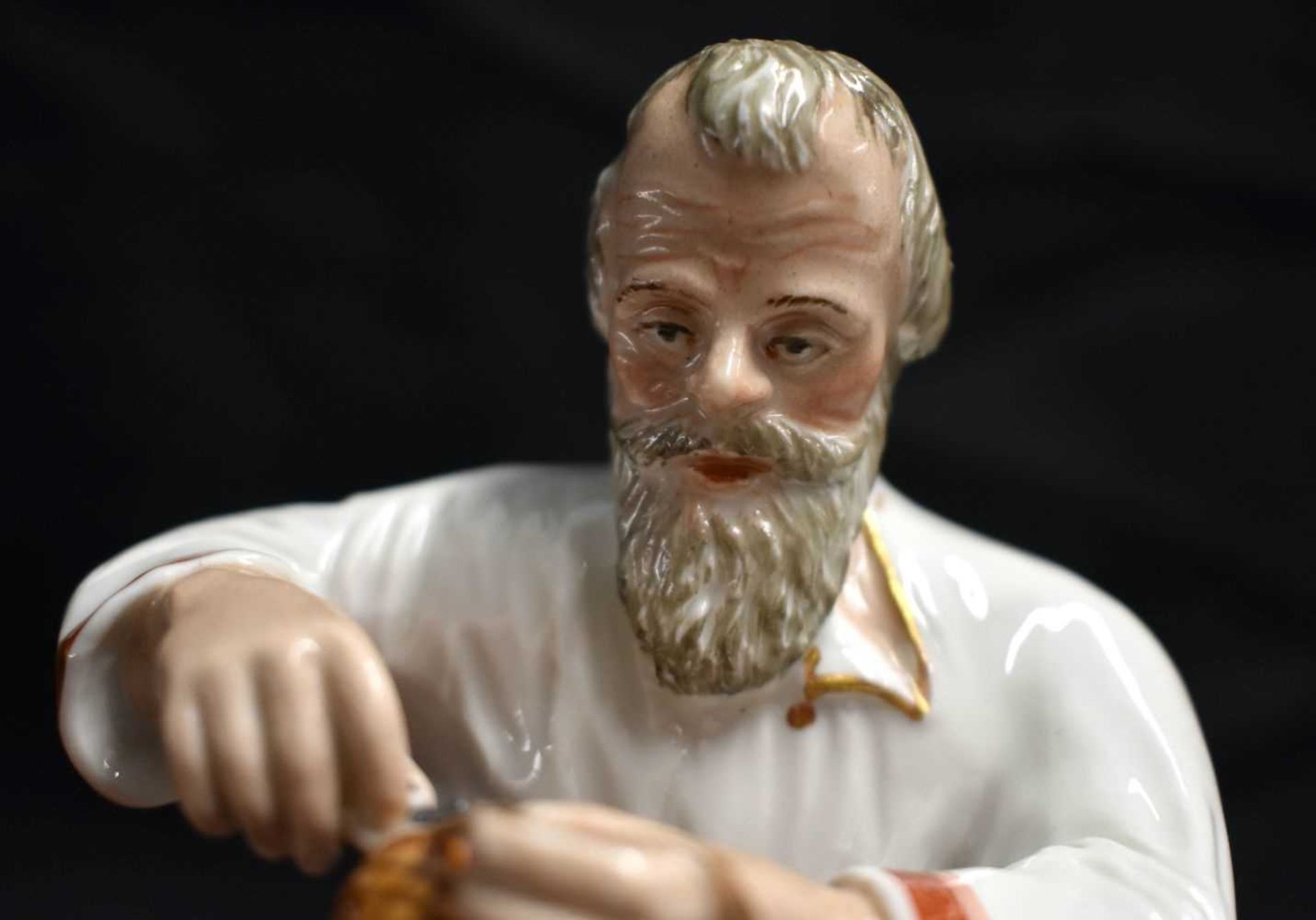 A LATE 19TH CENTURY RUSSIA ST PETERSBURG PORCELAIN FIGURE OF A COBBLER modelled repairing a shoe. 14 - Image 2 of 7