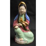 A LATE 19TH CENTURY CHINESE FAMILLE ROSE PORCELAIN FIGURE OF A FEMALE IMMORTAL Qing, modelled with a